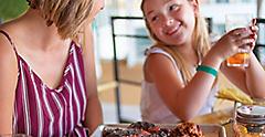 Oasis of the Seas Portside BBQ Mom Daughter Eating Chicken