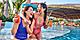 Women laughing and drinking cocktails