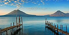 Shore docks view with volcanoes in Background